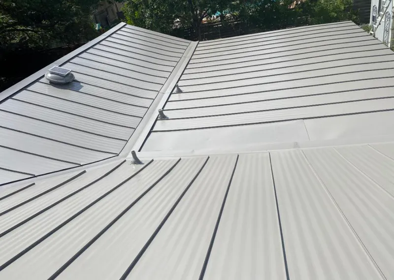 Solar attic fan installed on a metal roof for Roof Ventilation in Lugoff